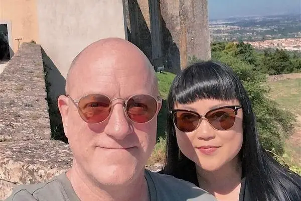 Dory and Steven taking a selfie in front of a castle tower