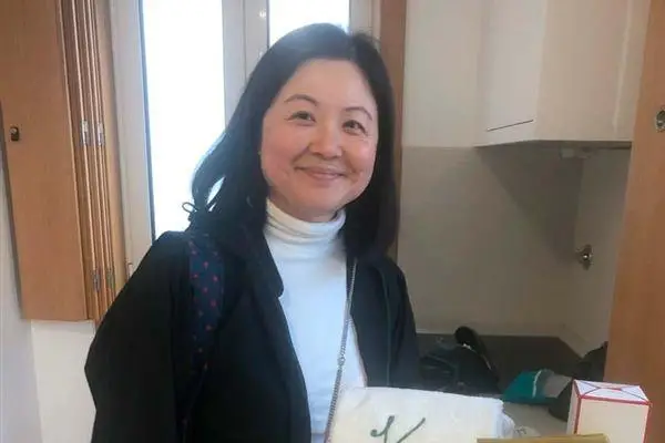 Karen holding a welcome basket